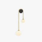 Clérachic arched brass wall sconce photographed unlit on white, the whole 56 cm frame in one clean silhouette.