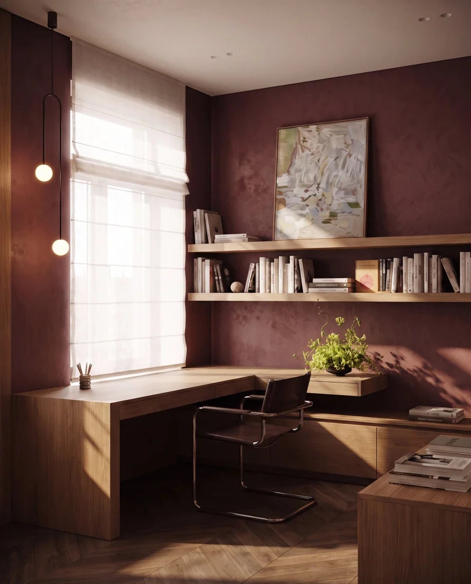 Clérachic slim black arch pendant with two lit globes beside a window in a study with shelves and a wooden desk.