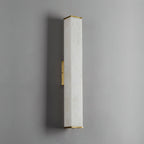 The Clérachic squared sconce unlit, showing the pale alabaster face and satin brass bar flat against grey.