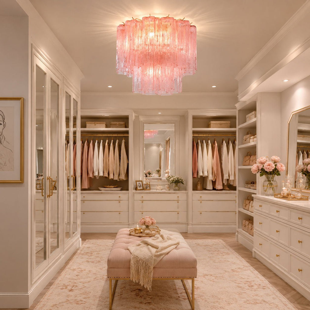 Pink Clérachic flush mount above a dressing room with built-in wardrobes, hanging clothes and a blush upholstered bench.