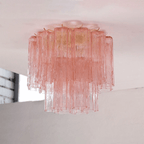 Pink art glass Clérachic flush mount seen from the side, with the pink tubes fading to clear at the bottom tier.