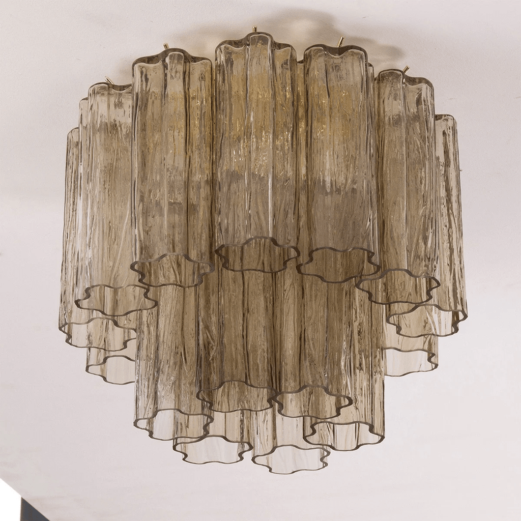 Looking up at the smoky grey-brown glass tubes of this Clérachic flush mount, showing the star-shaped ends of each tube.