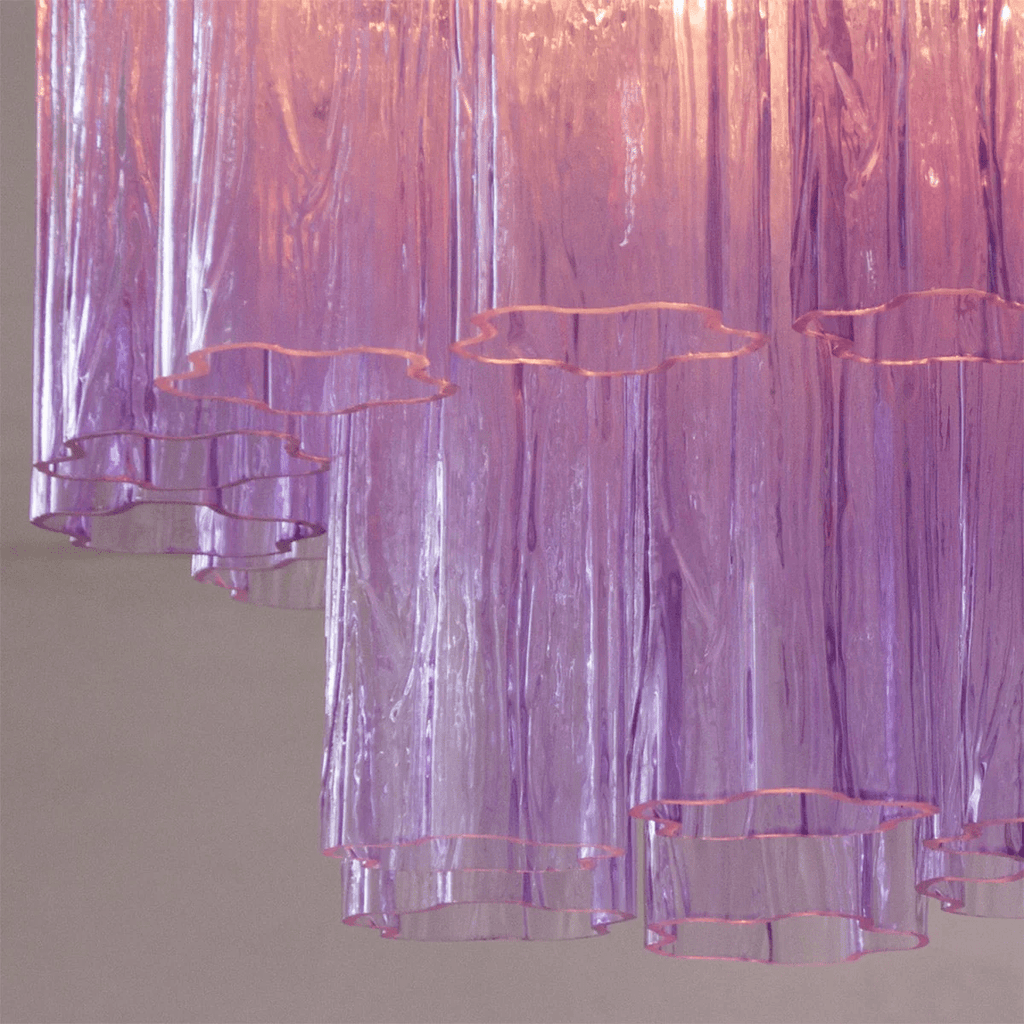 Close view of the purple art glass tubes on this Clérachic flush mount, with their wavy, star-shaped open ends.