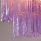 Close view of the purple art glass tubes on this Clérachic flush mount, with their wavy, star-shaped open ends.