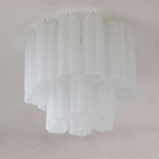 White frosted glass Clérachic flush mount with two tiers of tubes, unlit on a pale ceiling.