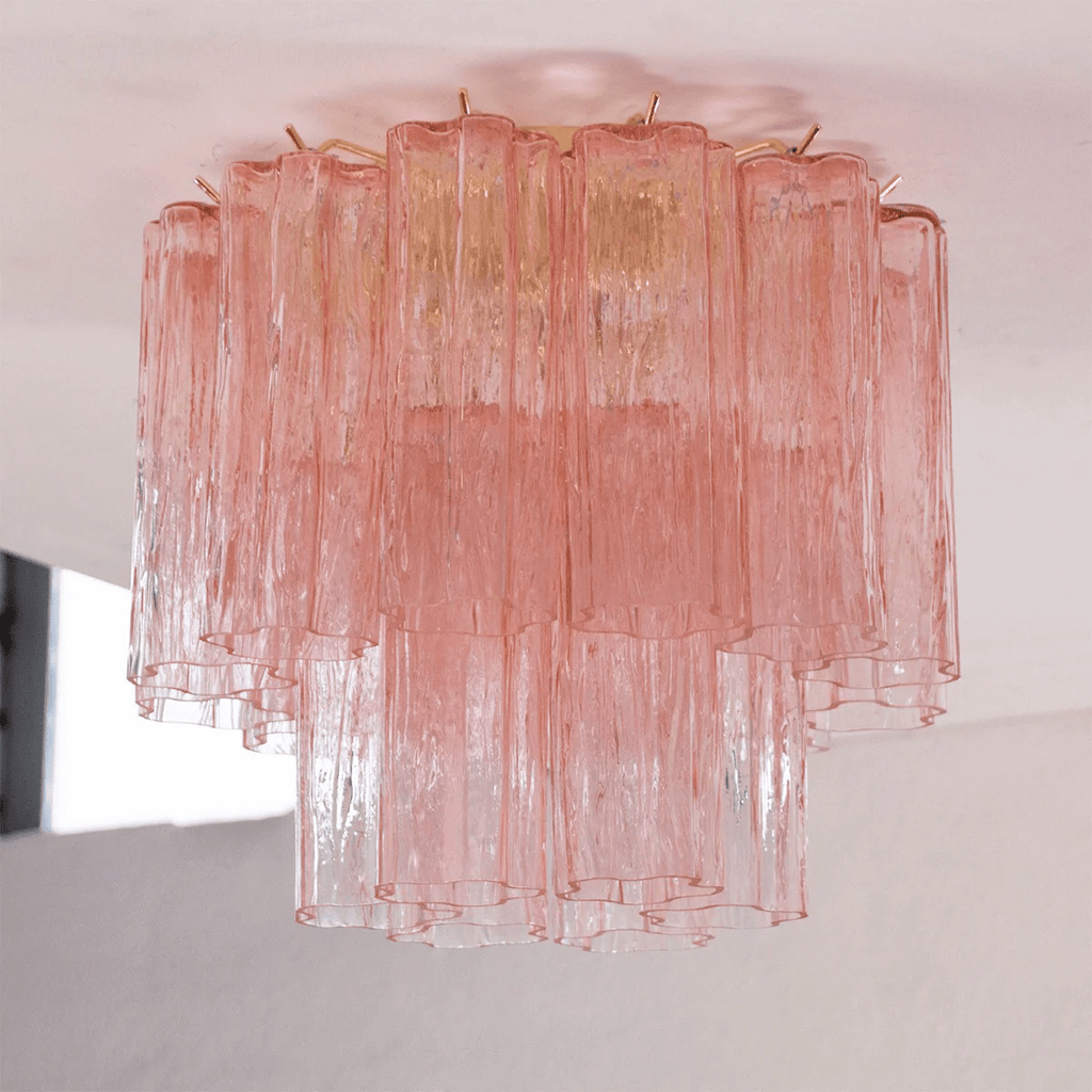 Pink art glass Clérachic flush mount hanging from a white ceiling, with the upper tier in rose and the lower tier shading to clear.