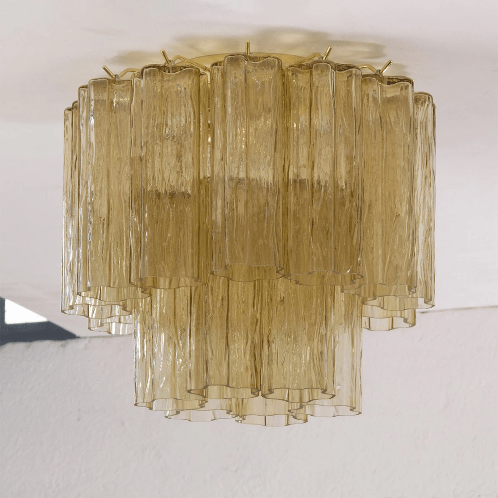 Straight-on view of this Clérachic flush mount in olive-gold glass, with textured tubes in two tiers against a white ceiling.