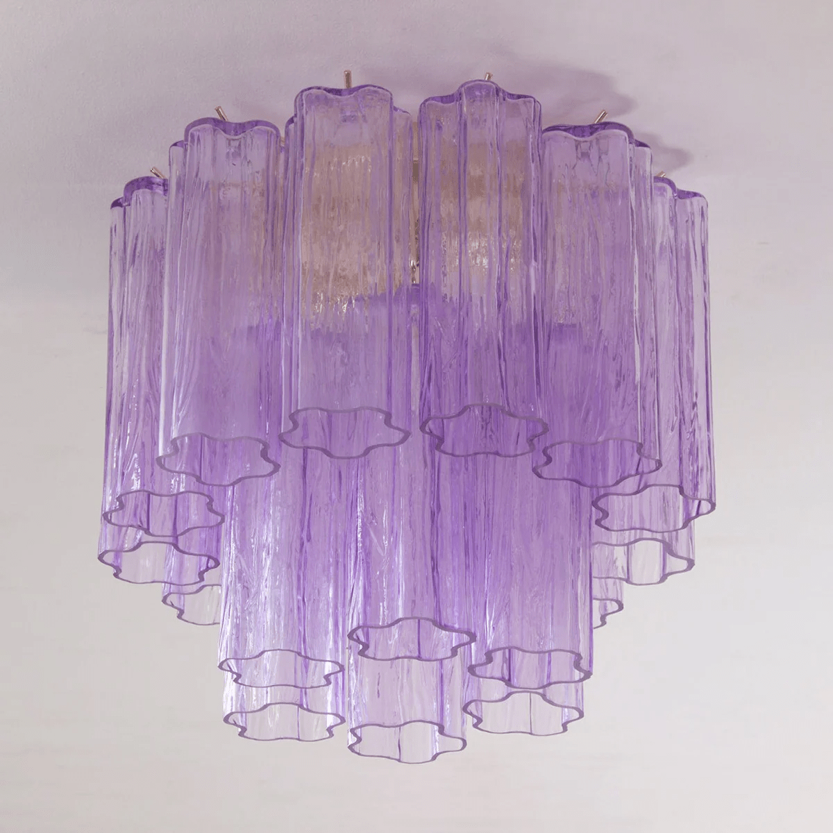 Purple art glass Clérachic flush mount with clear-edged tubes, hanging in two tiers from a pale ceiling.
