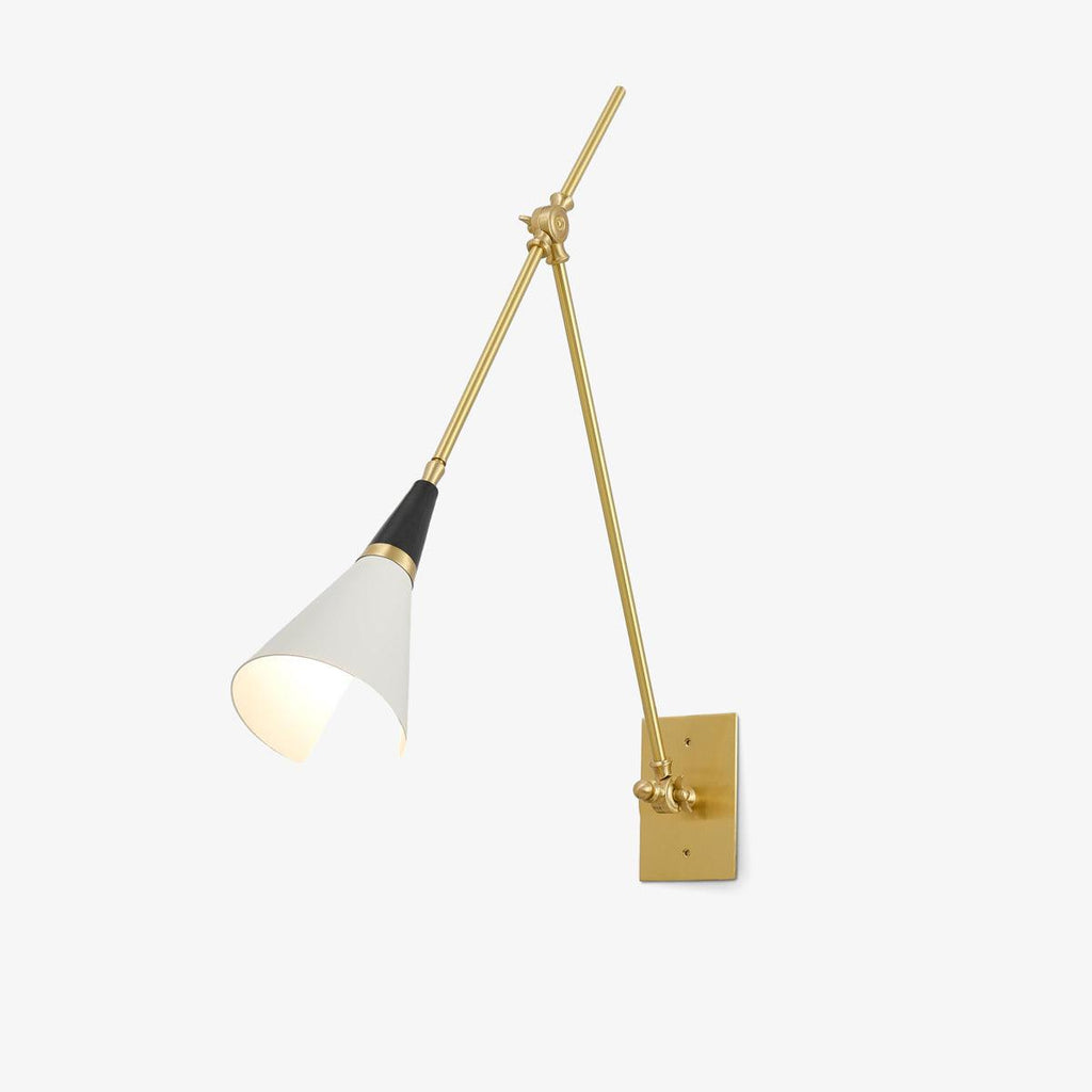 Clérachic articulated wall light on a white backdrop, with a white conical shade, a black neck and two brass arms jointed to a rectangular backplate.