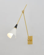 Clérachic wall light with a white cone shade turned inward, on a pale wall that meets a corner on the left.