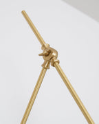 Close view of the central brass joint on this Clérachic wall light, with two slim arms meeting at a locking knuckle.