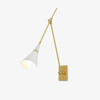 Clérachic wall light with a white cone shade and brass collar on its arm, on a plain light backdrop, seen from a lower angle.