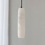 The Clérachic Asbury unlit and close up, showing the cool white alabaster grain and the black fitting at its crown.