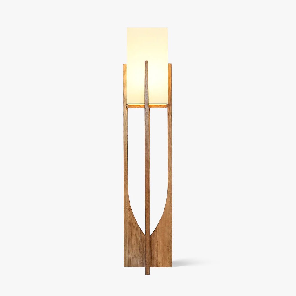 Tall ash wood frame with a curved cut-out and a white fabric shade, this Clérachic floor lamp shown lit on a plain white backdrop.
