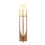 Dark-wood version of this Clérachic floor lamp on a white backdrop, its fabric shade lit and its curved cut-out in view.