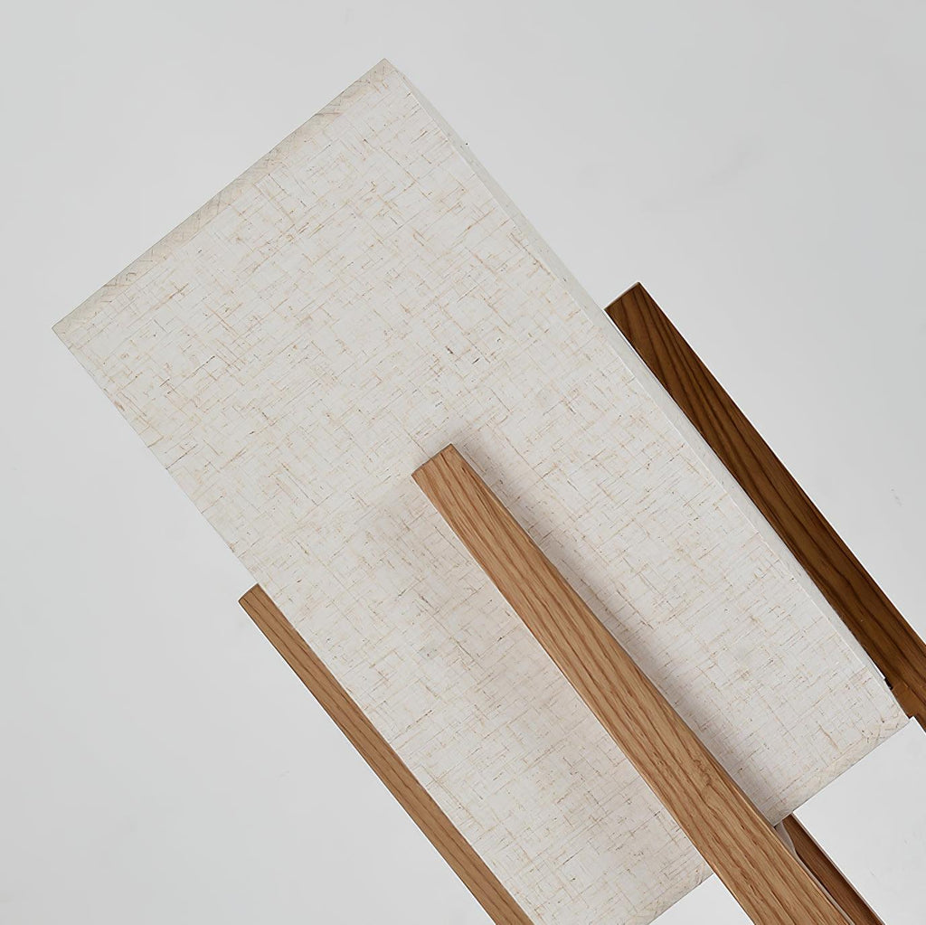 Close view of the linen-textured fabric shade and the wooden frame of this Clérachic lamp, seen from above.