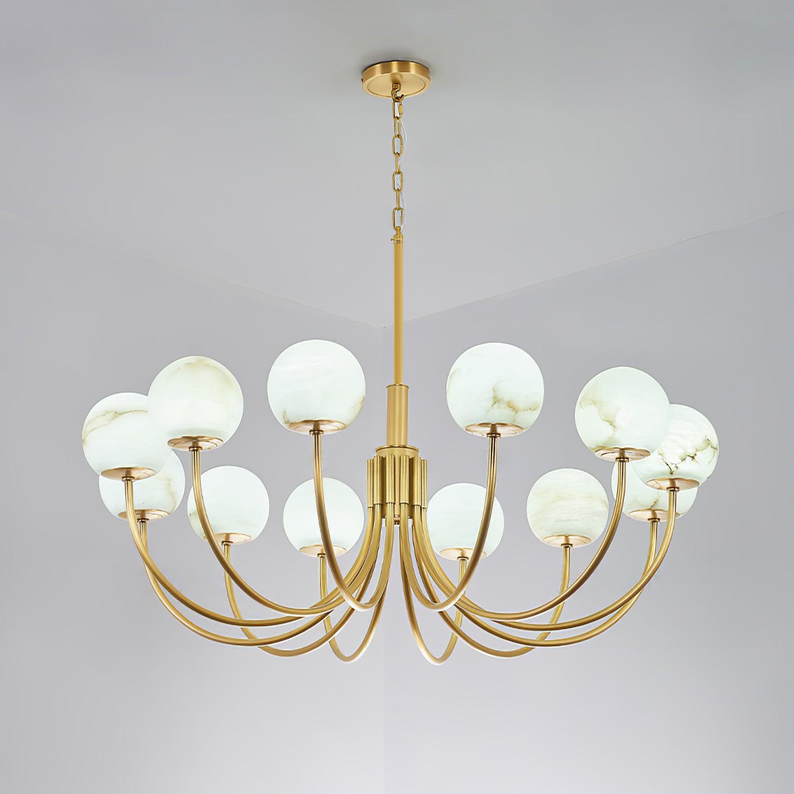 The Clérachic Aurelian chandelier against a pale ceiling, its alabaster globes lit softly.
