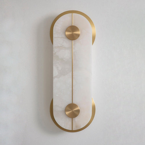 The Clérachic Auriel at larger scale, alabaster front plate framed by a slim brass spine running between two crescent discs.