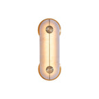 Clérachic Auriel photographed lit on plain white, the alabaster glowing warm amber between its polished brass crescents.