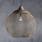 The large Clérachic mesh pendant shows its wide globe silhouette against a gray backdrop.