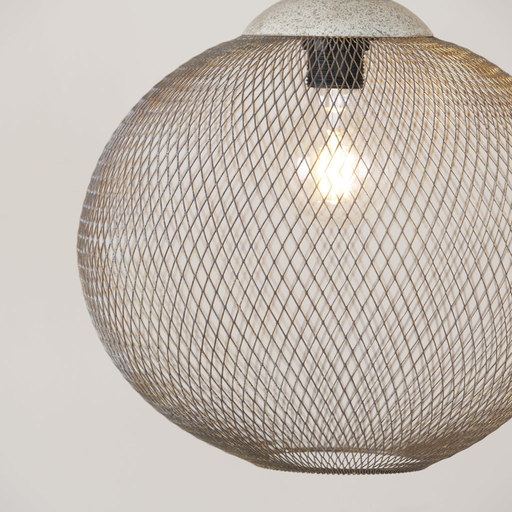 The Clérachic mesh pendant shows its dome cap and glowing wire cage in close-up.