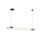 The Clérachic Avert pendant on plain white, a slim alabaster bar suspended on two fine steel cables.