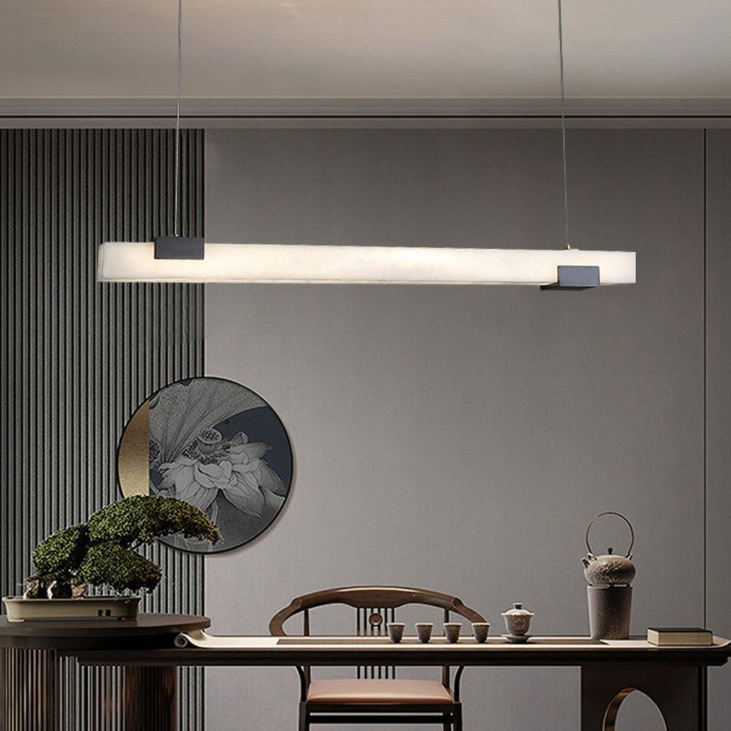 Clérachic Avert lighting a tea setting below a round landscape roundel and vertical fluted wall panels.