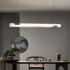 Clérachic Avert lighting a tea setting below a round landscape roundel and vertical fluted wall panels.