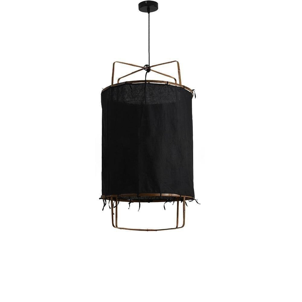 The pendant in a solid black shade, unlit against white, showing the bamboo lower ring and fabric ties.