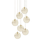 The seven-head Clérachic alabaster pendant seen against white, seven stone discs spiralling down on fine cables.