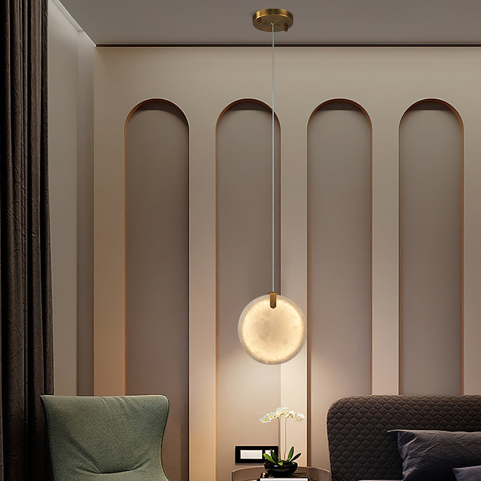 A single Clérachic alabaster disc lit above a bedside table, washing a warm halo onto an arched panelled bedroom wall.