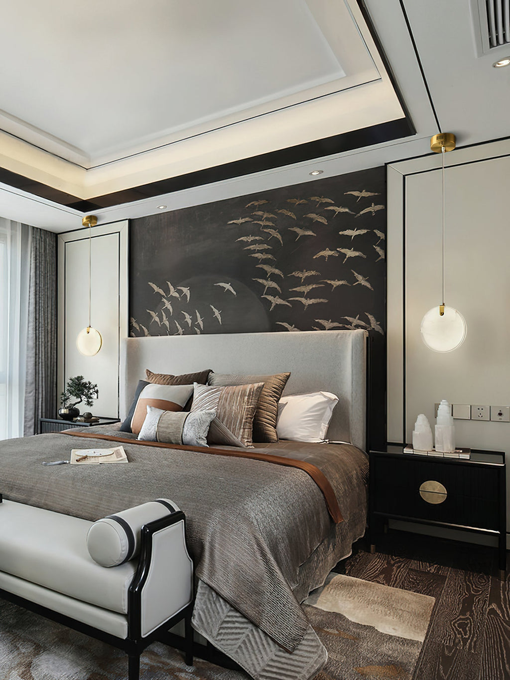 A pair of Clérachic alabaster pendants flanking a bed, one at each side of a headboard set against a bird mural.