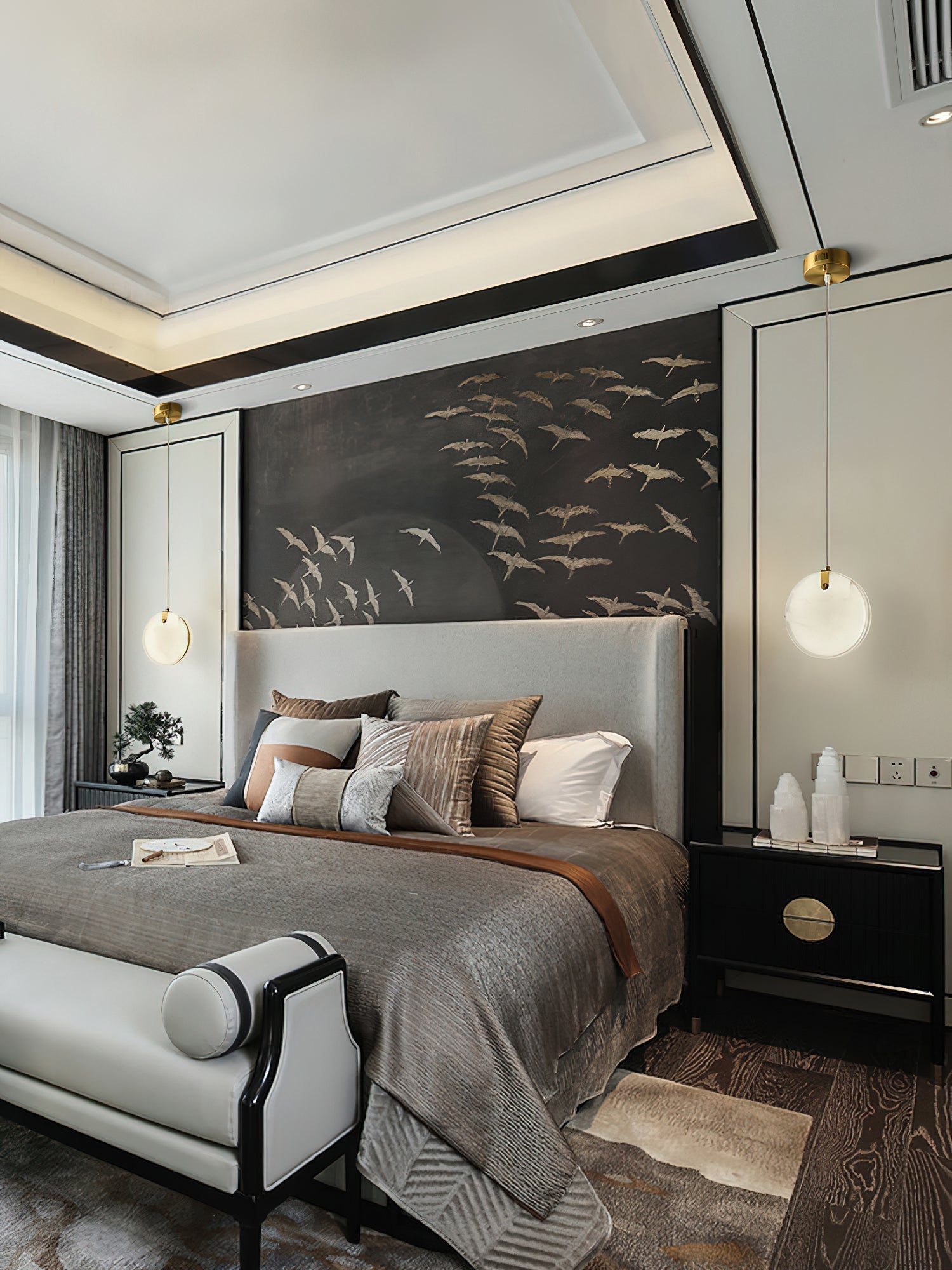 A pair of Clérachic alabaster pendants flanking a bed, one at each side of a headboard set against a bird mural.