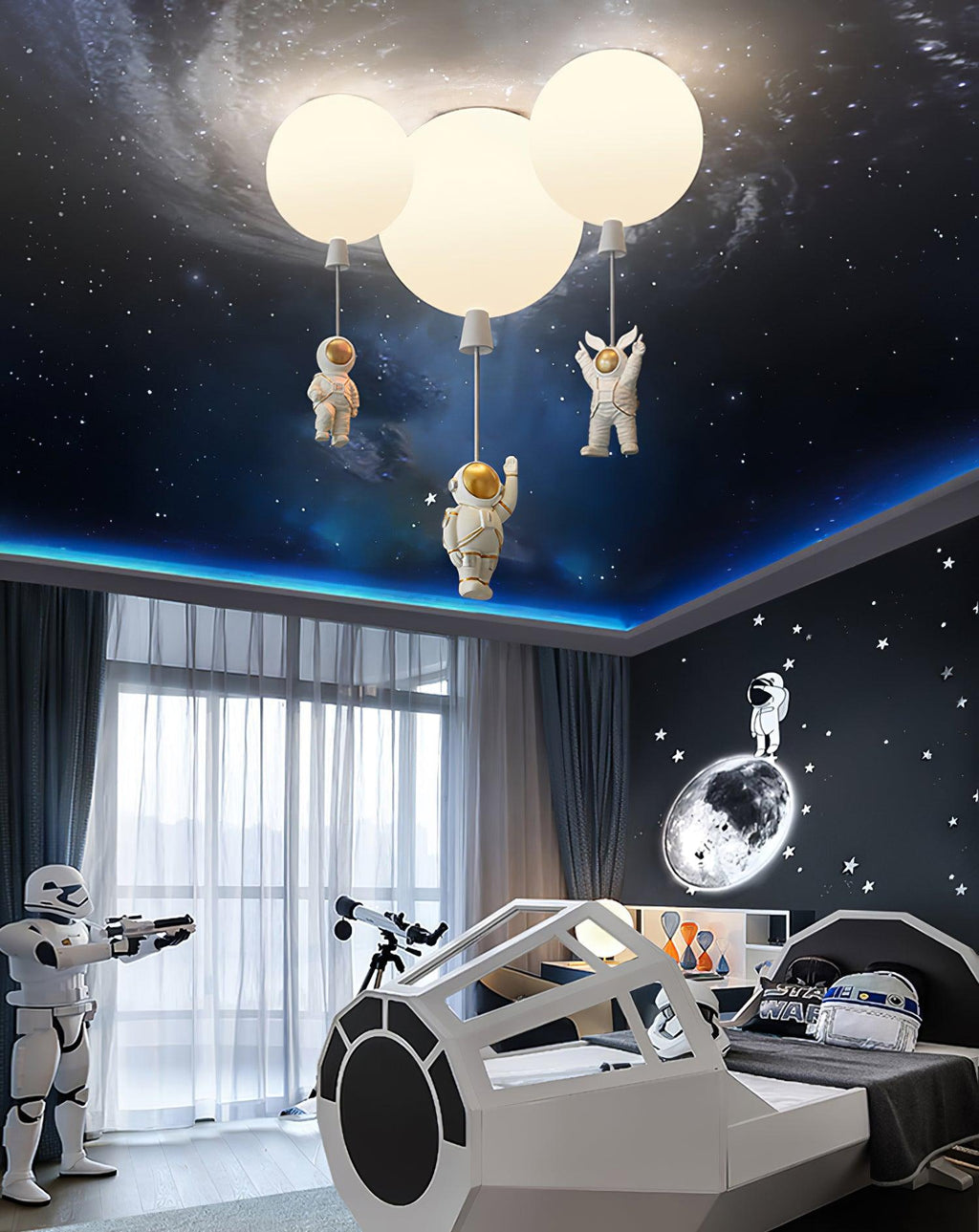 Three white Clérachic balloon lights glowing under a starry ceiling, above a spaceship-shaped bed in a space-themed room.