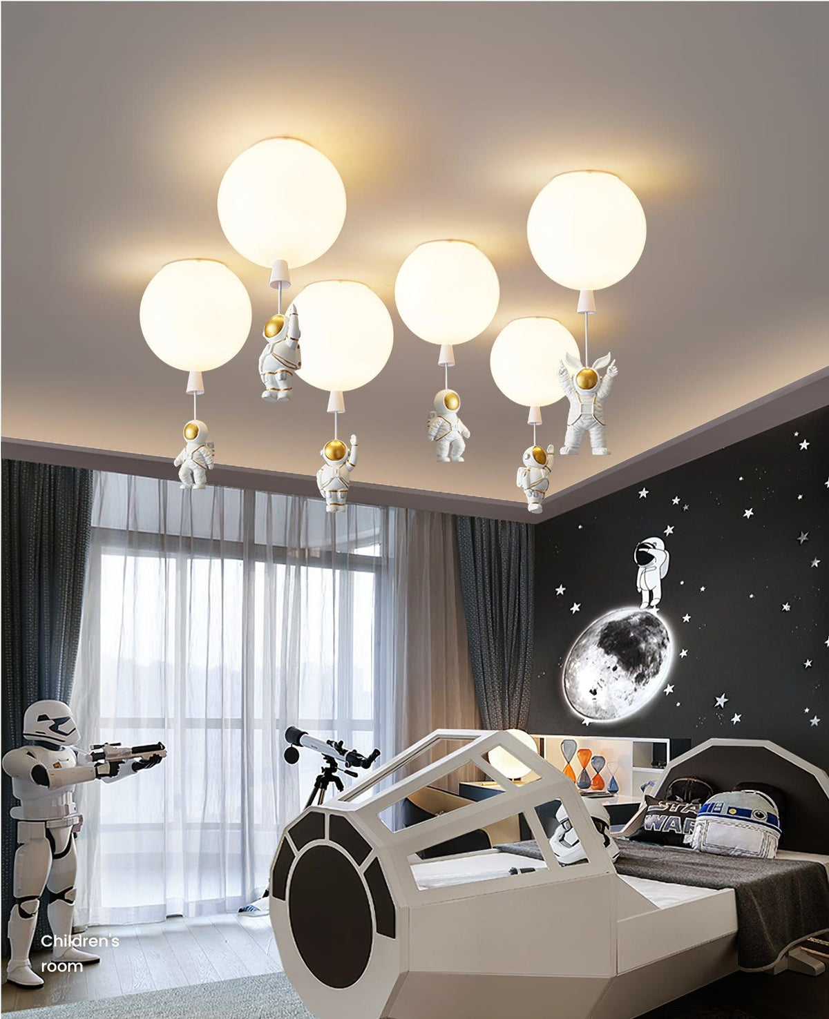 Six white Clérachic balloon lights with astronauts cluster on a ceiling above a spaceship bed and a window with sheer curtains.