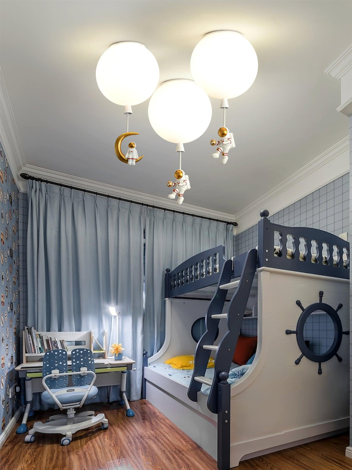 Three white Clérachic balloon lights with astronauts and a crescent moon above a blue room with a ship-style bunk bed.