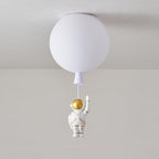 White Clérachic balloon ceiling light with a small waving astronaut, shown against a soft grey wall.