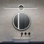 Clérachic black bar wall light over a round mirror with an LED rim, on a grey concrete wall with a white basin.