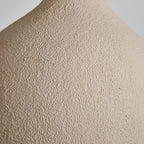 Close view of the rough, sandy beige texture on the outer surface of this Clérachic pendant light.