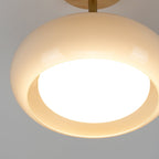 Detail of the Clérachic Bauhaus glass disc ceiling light, the lit opal diffuser recessed into the open underside.
