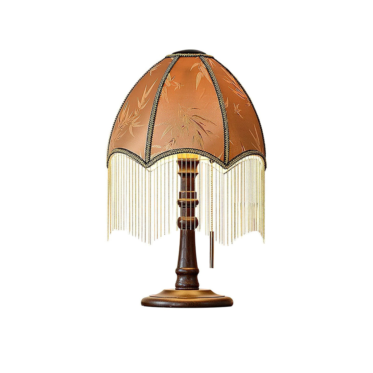 Front view of the brown panelled shade with its beaded fringe, the pull chain and the round walnut-colour base of this Clérachic table lamp, cut out on white.