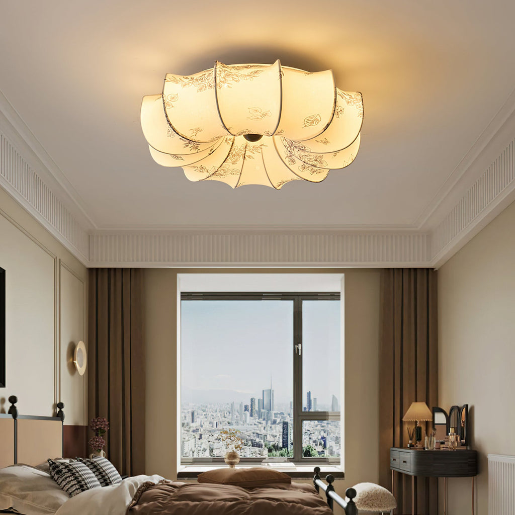 Clérachic fabric ceiling light lit above a bedroom with brown curtains and a city view through the window.