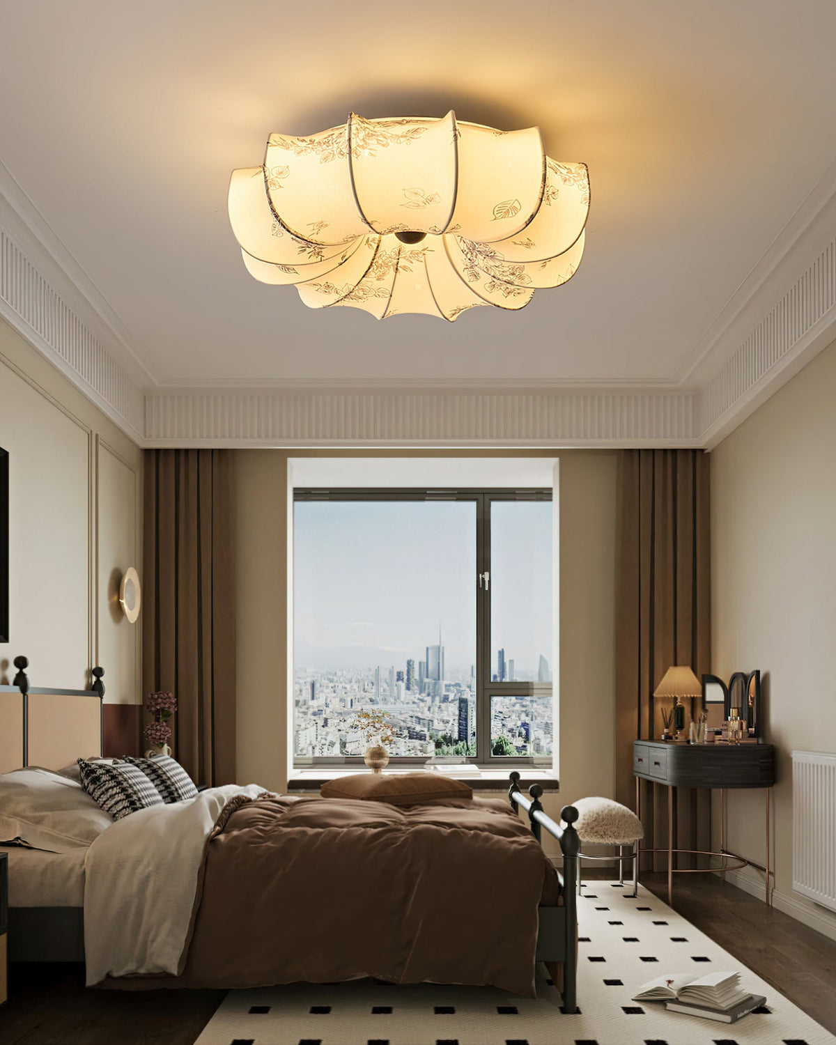Wide view of a bedroom with a Clérachic fabric ceiling light lit above, dark curtains and a black-and-white tiled rug.