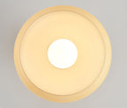 Underside view of the beige glass dome of this Clérachic ceiling light, the round bulb glowing at its centre.
