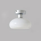 White glass dome with a polished chrome canopy, a Clérachic ceiling light on a mid-grey backdrop.