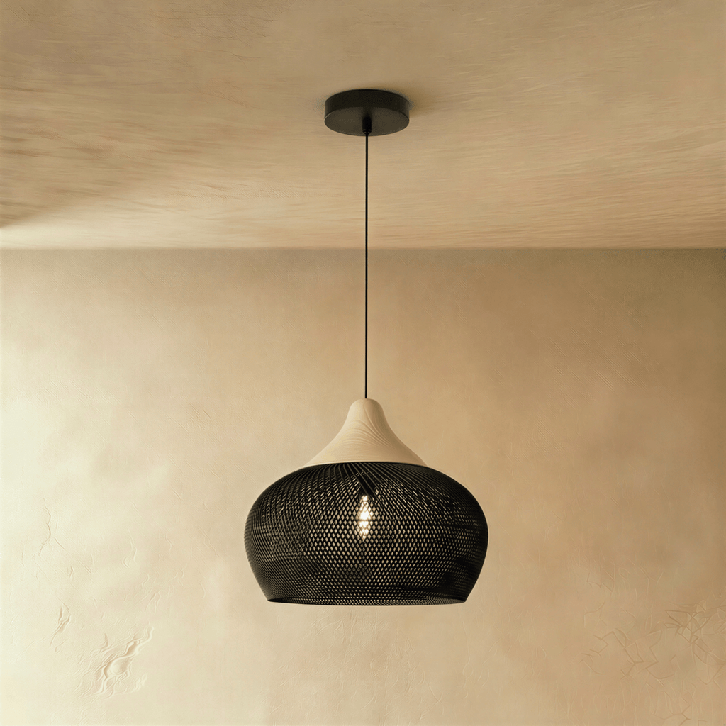 Clérachic black woven rattan pendant light with a rounded dome shade and beige wood cap suspended from the ceiling.