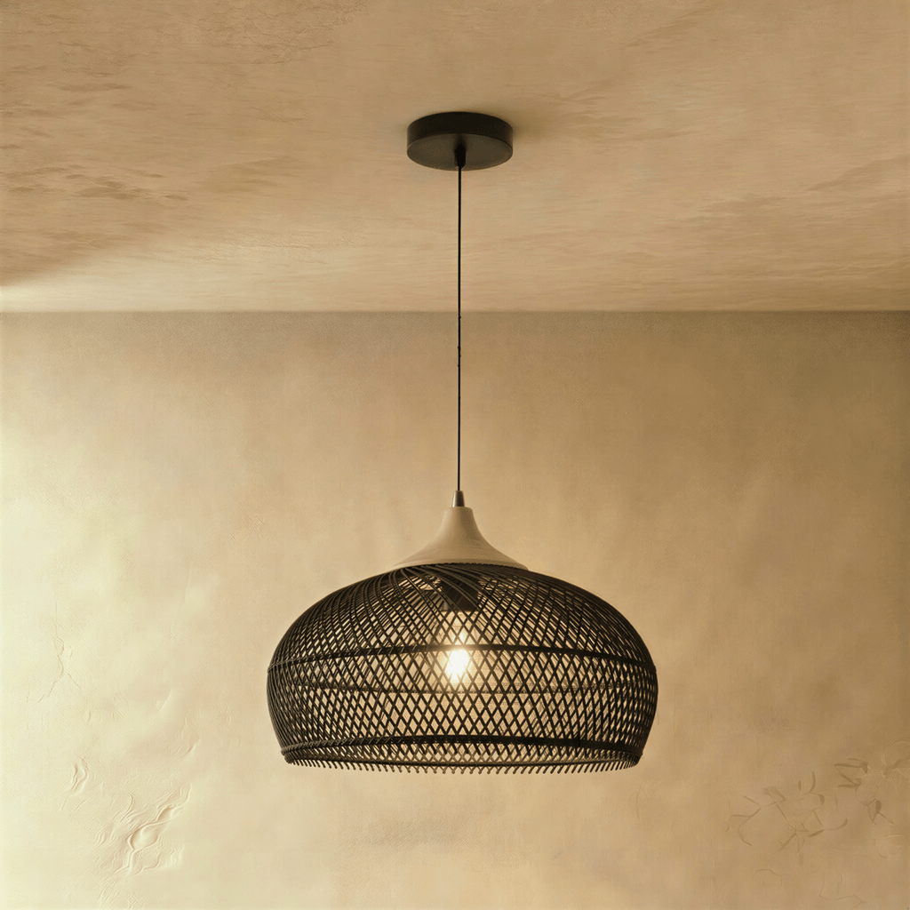 Clérachic black rattan dome pendant light with an open weave shade and beige wood cap hanging from a black cord.