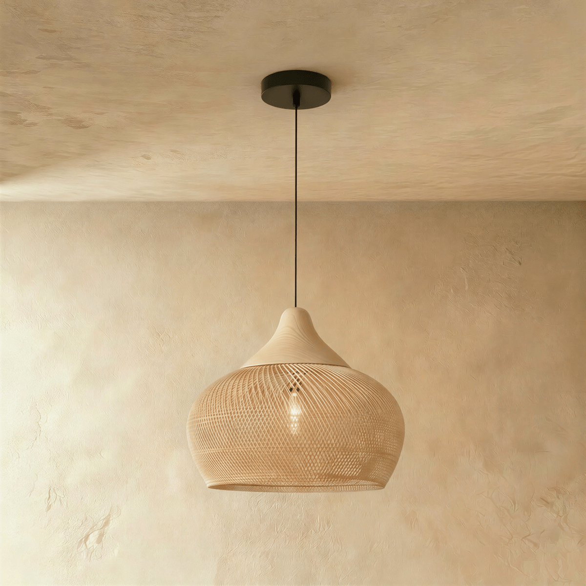 Clérachic natural rattan pendant light with a beige teardrop cage shade and wood cap suspended from a black cord.