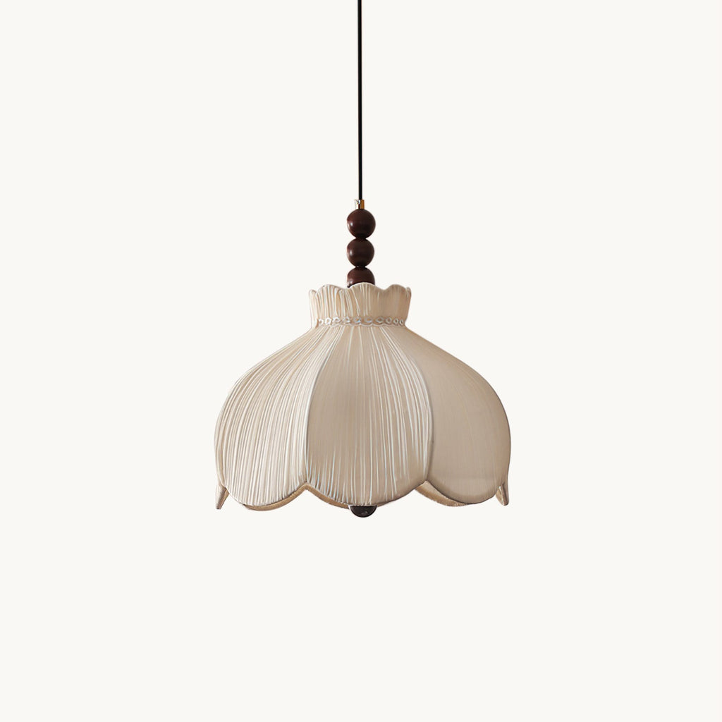 Beige pleated fabric Clérachic pendant with a scalloped petal shade and walnut-coloured beads, on a plain white backdrop.