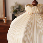 Close view of the fine vertical pleats and the floral lace band at the neck of this Clérachic pendant shade.